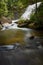 Gentle, calm pool rests at the bottom of Glen Cannon Falls in North Carolina