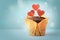 Gentle festive background. chocolate cupcake with red hearts