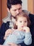 Gentle hugs dad with daughter. Tender relationship of father to daughter. Positive emotions. Tenderness and parental love. Feeling