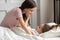 Gentle mother puts daughter to sleep in the afternoon nap