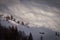 Gentle snow-covered slope with small isolated hut tilt shift effect
