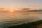 Gentle soft light pink dawn on the big lake, Sunrise, calm, fog, horizon line