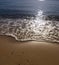 Gentle surf on golden sand