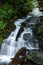 Gentle waterfall cascades down the mountain side after heavy rains in Pisgah Forest