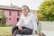 Gentleman on a deck chair in country house