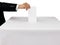 Gentleman hand putting a voting ballot in slot of white box