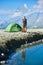 Gentleman standing by camp tent in mountains.