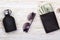 Gentlemanly set: sunglasses, perfume, wallet with money on wooden background