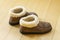 Genuine Shearling Slip On Soft Sole Moccasin - Sheepskin Comfort Slippers on wooden floor