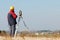 Geodesy. surveyor worker with theodolite