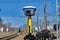 Geodetic GNSS receiver in the field in Siberia, mounted on a tripod