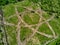 Geoglyph in the form of an atom symbol, an outline where trees are planted, aerial view. District of the city of Balabanovo,