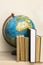 Geographic globe and books