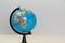 Geographical globe on light background, copy space. Model of Earth. Education and travelling concept. Place for text