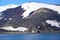 Geologic layers on volcanic mountains of Deception Island, Antarctica. Small sunken tanks of abandoned whale station, Lost places,