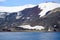 Geologic layers on volcanic mountains of Deception Island, Antarctica. Small sunken tanks of abandoned whale station, Lost places,