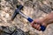 Geological hammer in hand