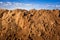 Geological soil cut on blue sky background