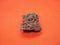 Geological specimen of natural red Pumice pumicite, volcanic rock