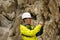 Geologist examines a sample of stone outdoor