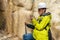 Geologist examines a sample of stone outdoor