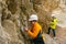 Geologists against the rocks in the canyon