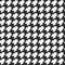 Geometric black and white seamless pattern with pied-de-poule ornament. Monochrome graphic repeating design. Modern