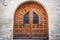 Geometric brown wood antique door and glass windows