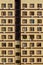 Geometric facade of a yellow residential building