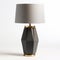 Geometric Gold Colored Lamp With Gray Shade On Wooden Base