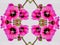 Geometric Kaleidoscope of Bright Pink Flowers