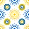 Geometric openwork flowers sunflowers blue and yellow on a white background. Seamless modern pattern.