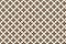 The geometric patterned background image has a tiled black-brown color