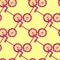 Geometric seamless pattern with bright pink bicycle silhouettes ornament. Light yellow background