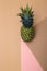 Geometric still life with pineapple on a colored background