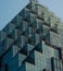 Geometric structure of Wuhan Qintai Grand Theater under a clear sky. A typical modern art building.