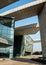 Geometric structure of Wuhan Qintai Grand Theater under a clear sky. A typical modern art building.