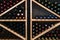 Geometric Wine Rack Filled with Assorted Bottles. Well-stocked wine rack featuring displaying an array of red, white