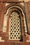 Geometrical patterns were sculptured on the frame of a window at Qutb minar in New Delhi (India)