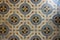 geometrical and symmetrical decorated square colorful ceramic tiles background floor close up