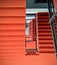 Geometry in Vibrant Orange Staircase and Metal Railing