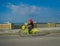 George Town, Malaysia - March 10, 2017: Beautiful scenic view of unknown muslim women riding bicycles along the