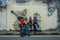 George Town, Malaysia - March 10, 2017: Unknown muslim tourists standing by Cannon graffiti, street art and iron