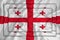 Georgia flag on background texture. Three flags are superimposed on each other. The concept of design solutions. 3D-rendering