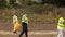 Georgia State Prison Inmate detail picking up trash on the side of the road in the morning with a Armed Correctional Officer