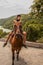 Georgian boy on horse near ancient Jvari Monastery - Motion blur