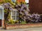 Georgian brick home with wisteria flowers in Ellesmere Shropshire