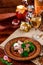 Georgian dish - phali of spinach and meat on a brown plate on a wooden background