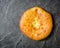 Georgian hot khachapuri bread on a dark background. Place for the text.