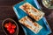 Georgian lavash, fresh pita bread on a plate on wooden background. Caucasian kitchen.